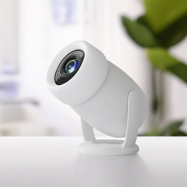 White projector on a white surface with a blurred background